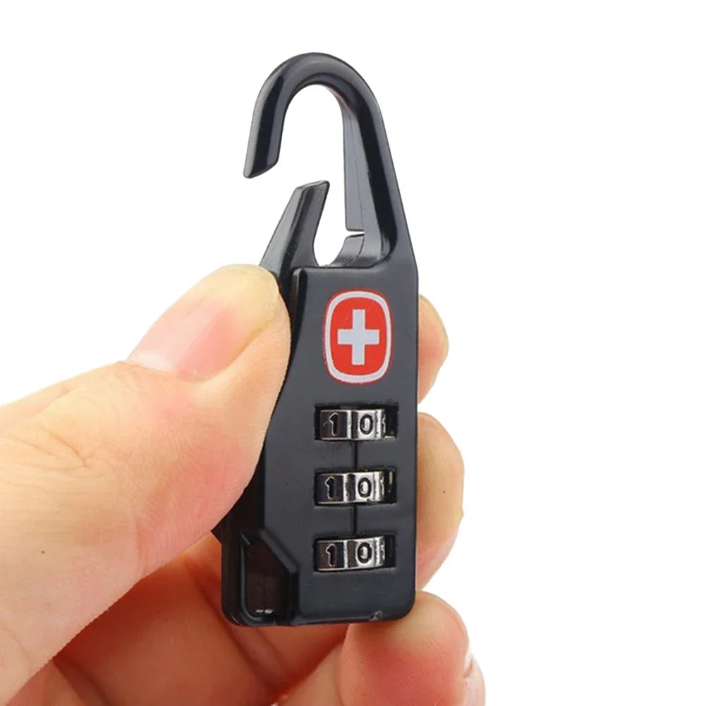 Black combination lock with Swiss cross logo held in a hand against a white background