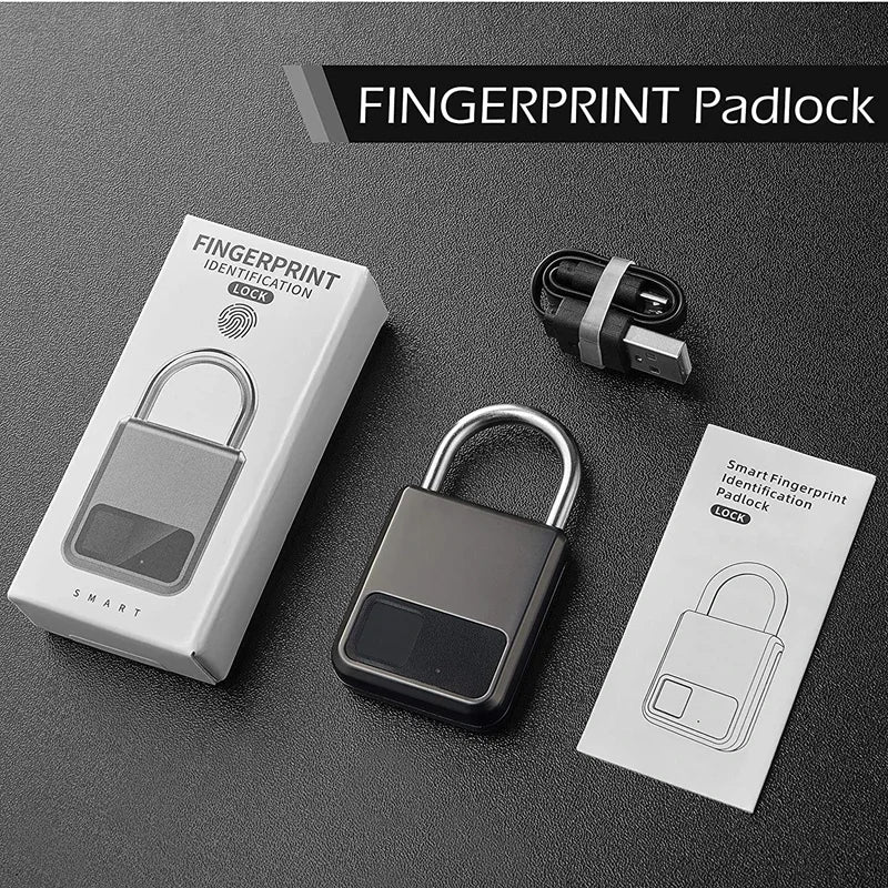 Fingerprint padlock with packaging and USB cable on a dark surface