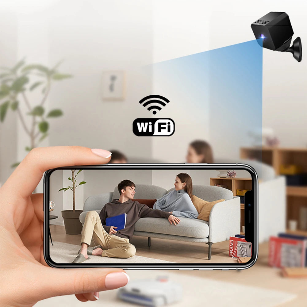 Hand holding a smartphone showing a video call with two people on a couch, with a WiFi symbol above.