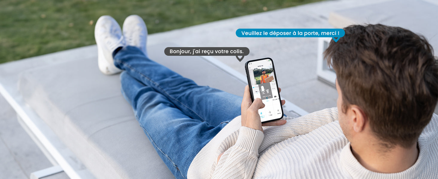 Man sitting on a chair using a smartphone with an app displayed, outdoors.