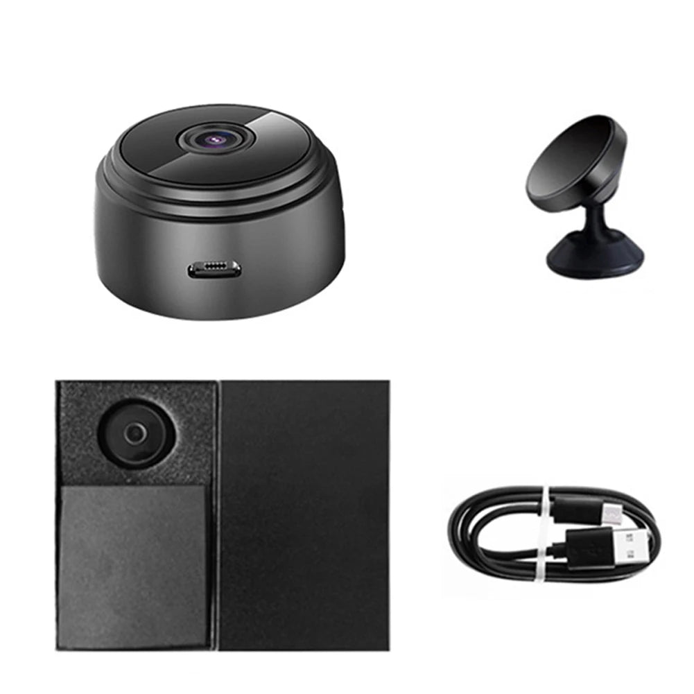Set of black electronic devices including a camera, stand, square component, and cable on a white background.