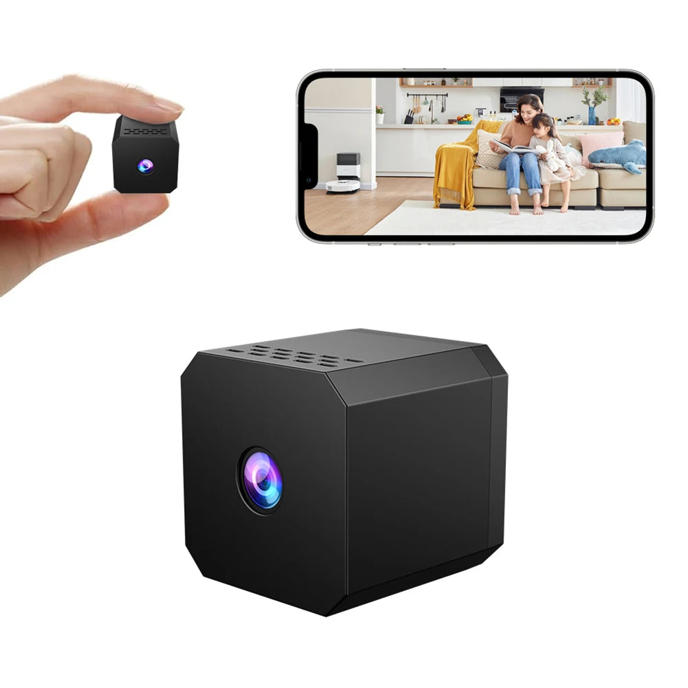 Small black camera held by a hand with a smartphone displaying a video call on a white background.