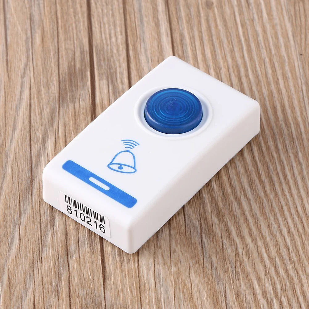 White electronic device with blue buttons on a wooden surface